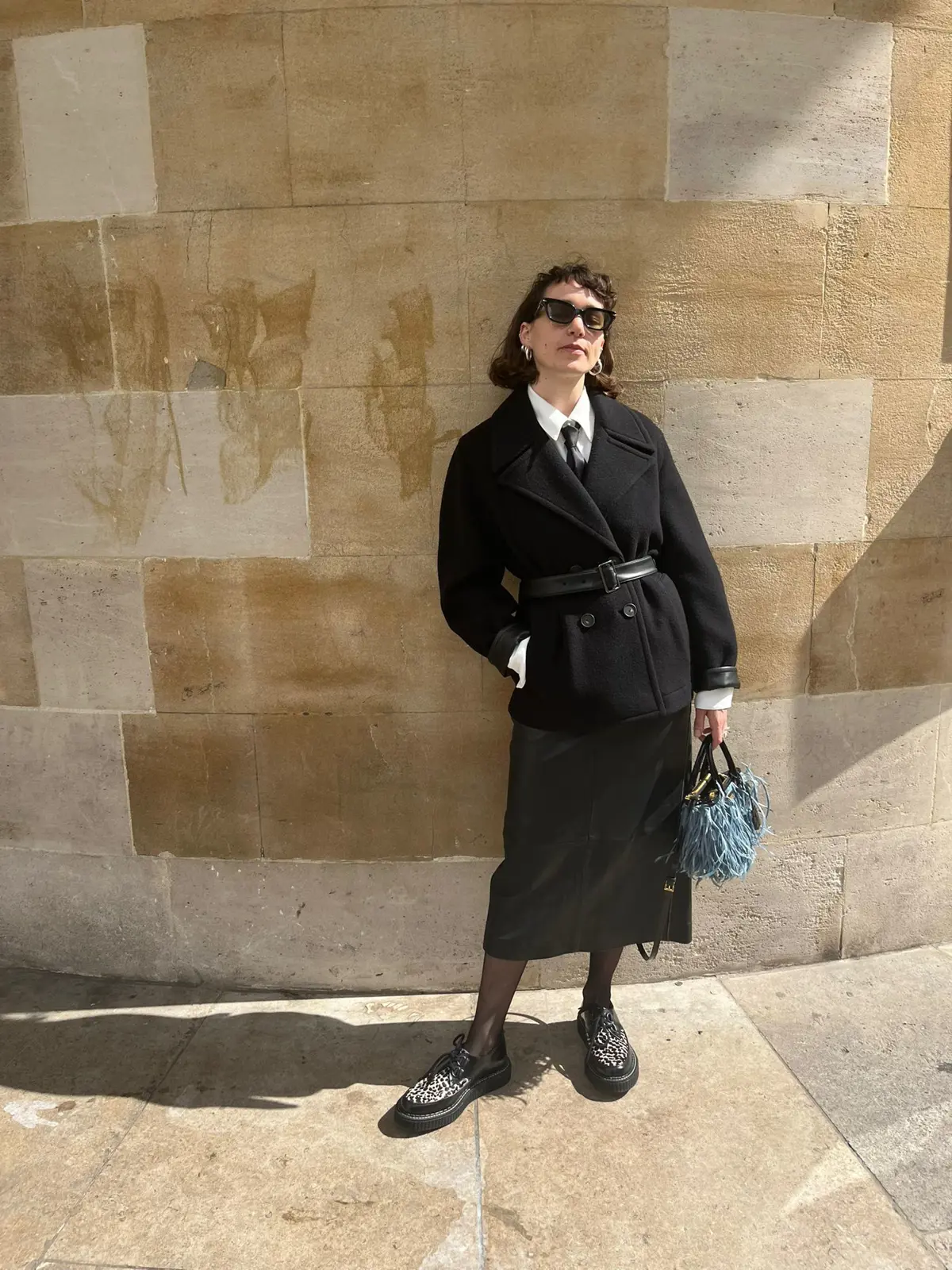 Nell Wears Black Leather Skirt And Peacoat